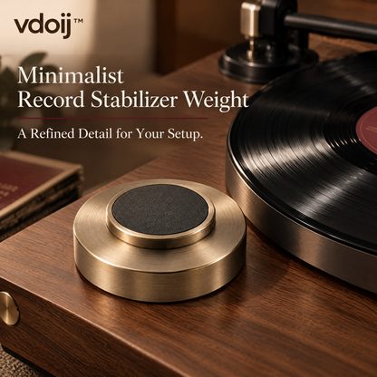 vdoij Brushed-Metal Vinyl Record Stabilizer beside a vinyl record
